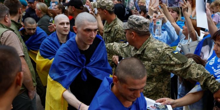 Soldiers return home after years in captivity as Ukraine-Russia prisoner swap begins
