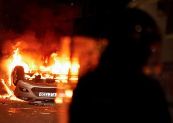 Masked rioters in Northern Ireland attack police, torch houses for second night
